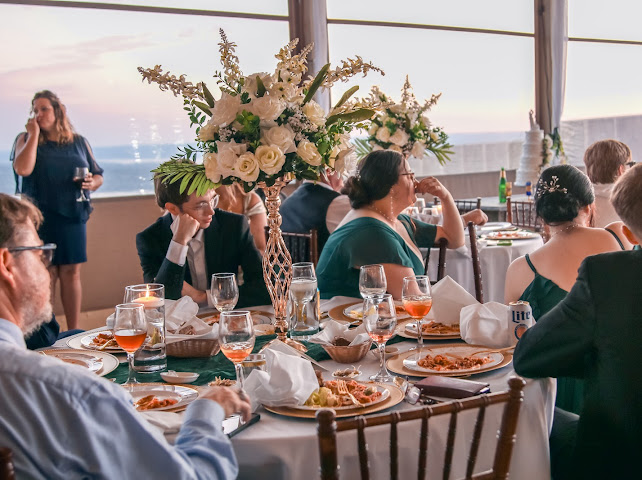 Wedding reception dinner with floral centerpieces